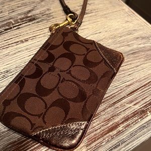 Coach Wristlet. Brown canvas logo and leather.
